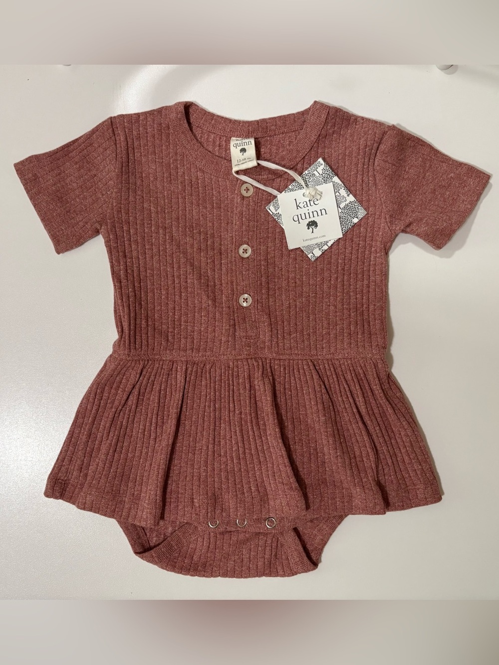 Kate Quinn Ribbed Peplum Skirted Romper in Dusty Rose Organic Cotton 12-18 mo